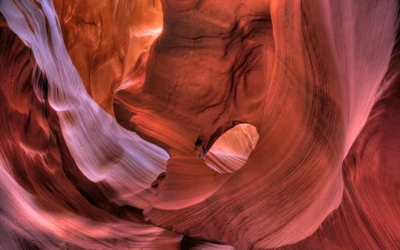 HD desktop wallpaper featuring the vibrant, swirling rock formations of Arizona's Antelope Canyon, showcasing the natural beauty of a slot canyon.