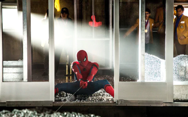 Spider-Man in action in a scene from Spider-Man: Homecoming movie, available as an HD desktop wallpaper and background.