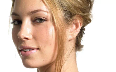 Close-up of Jessica Biel with a natural expression and styled hair, serving as an HD desktop wallpaper and background featuring the celebrity's charm.