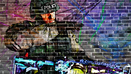 HD desktop wallpaper featuring graffiti-style art of a Counter-Strike: Global Offensive police character aiming a weapon against a vibrant brick wall background.