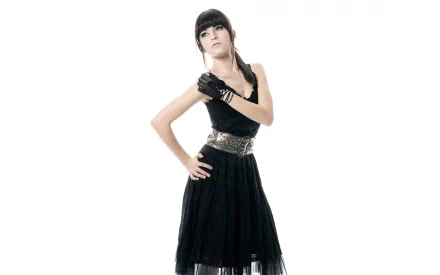 HD desktop wallpaper featuring a woman in a black dress and gloves, exuding a sensual vibe against a plain white background.