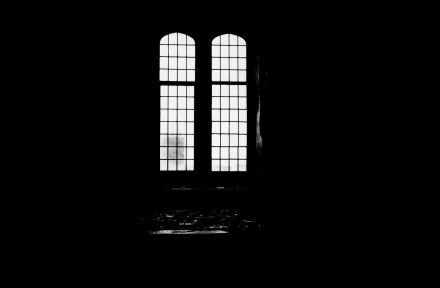 Black and white photography of a tall, arched window casting light and shadows, rendered as an HD PC desktop wallpaper and background.
