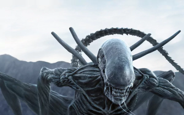 HD desktop wallpaper and background featuring a menacing alien from the movie Alien: Covenant against a mountainous backdrop.