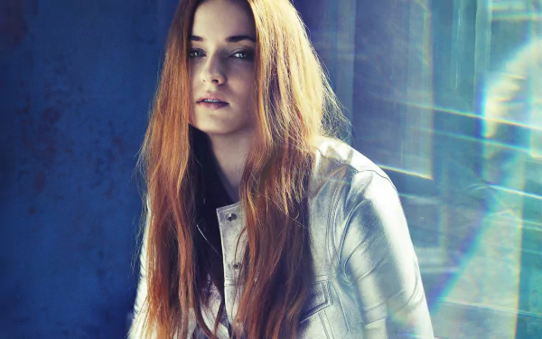 HD desktop wallpaper featuring a close-up portrait of Sophie Turner, an American actress with red hair and striking blue eyes.