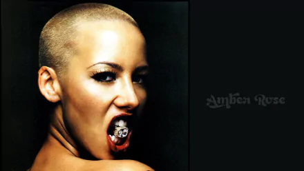 HD desktop wallpaper featuring a person with a shaved head biting a ring, against a dark background with Amber Rose text.