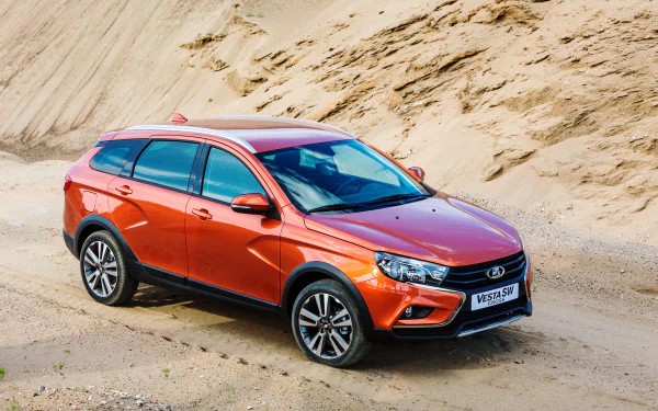 Orange Lada Vesta SW SUV parked on sandy dunes — 4K Ultra HD PC desktop wallpaper background.