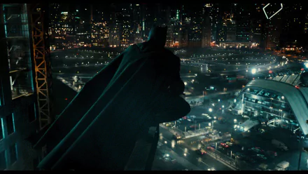 HD wallpaper featuring Ben Affleck as Batman from the movie Justice League (2017), overlooking a brightly lit cityscape at night.