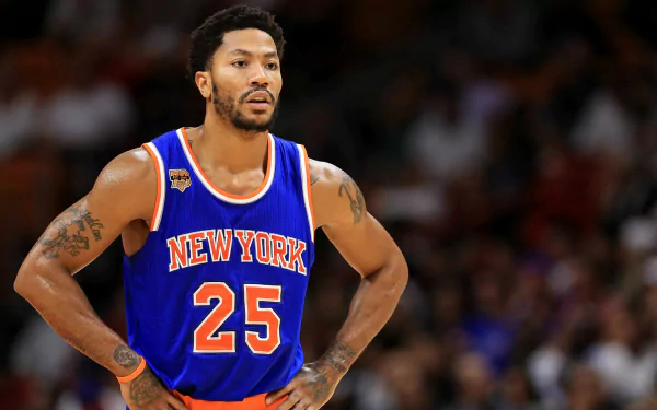 HD desktop wallpaper featuring Derrick Rose in a New York Knicks jersey during a basketball game.