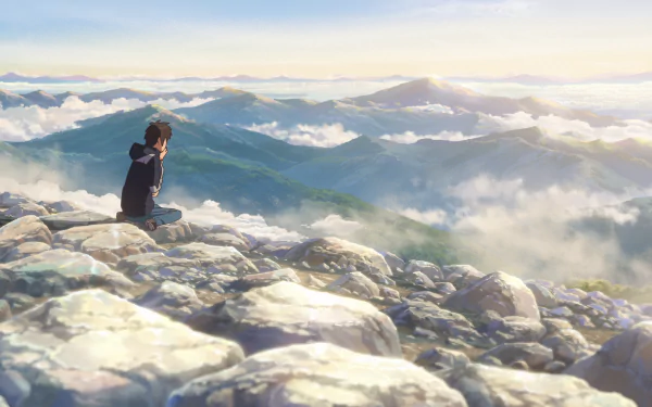 Taki Tachibana from Your Name. sits on rocky terrain overlooking misty mountains in this HD anime desktop wallpaper.