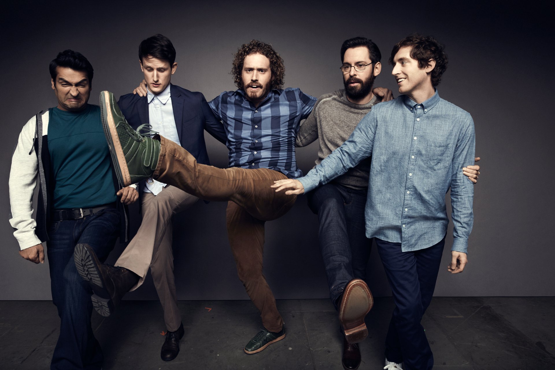 HD desktop wallpaper featuring a playful group of men, evoking the spirit of Silicon Valley, posing against a muted backdrop.