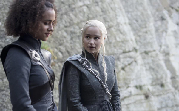 Emilia Clarke as Daenerys Targaryen and Nathalie Emmanuel as Missandei in a 4K Ultra HD Game of Thrones TV show wallpaper.