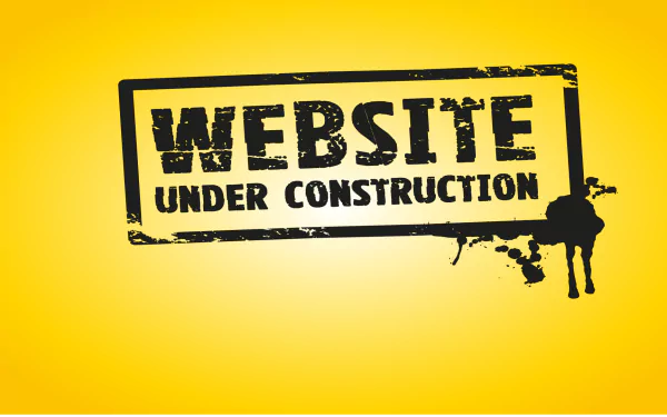 HD desktop wallpaper with a Website Under Construction sign on a yellow background.