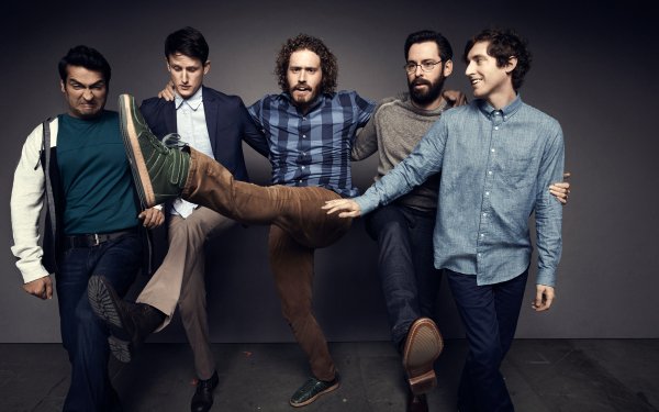 HD desktop wallpaper featuring a playful group of men, evoking the spirit of Silicon Valley, posing against a muted backdrop.