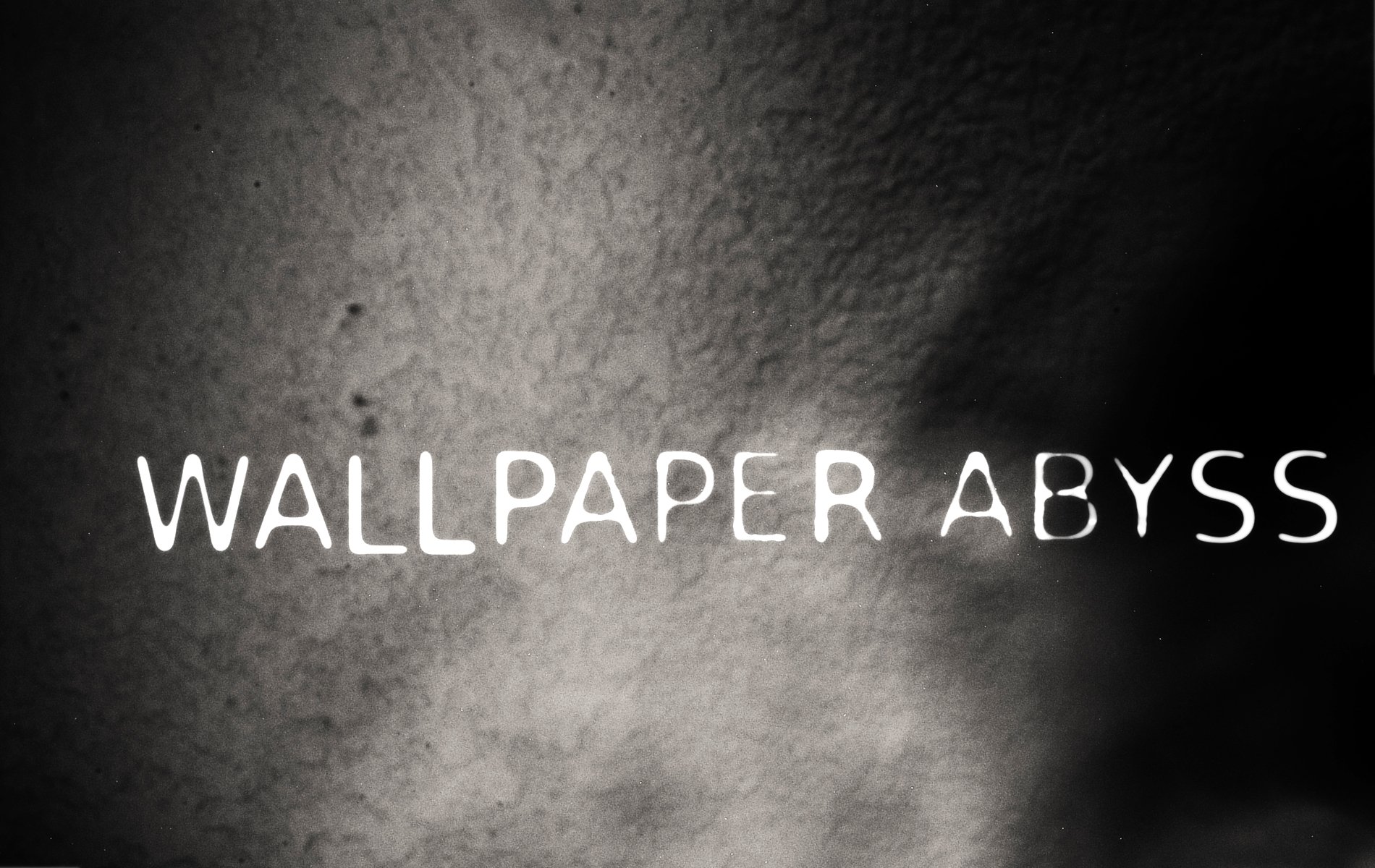 HD PC desktop wallpaper featuring a dark, textured background with the text WALLPAPER ABYSS centered, highlighting technology aesthetics.