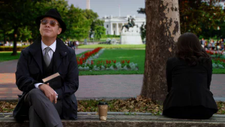HD PC desktop wallpaper from the TV show The Blacklist, featuring a man in a hat and sunglasses sitting on a park bench with a coffee cup and book.
