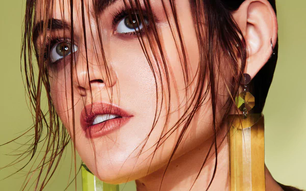 Close-up portrait of American actress Lucy Hale with brunette hair, wearing earrings, displayed in 4K Ultra HD for a PC desktop wallpaper.