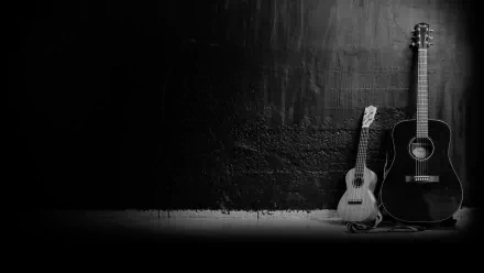 Black and white HD desktop wallpaper featuring a guitar and ukulele against a textured wall, capturing a minimalist music-themed scene.