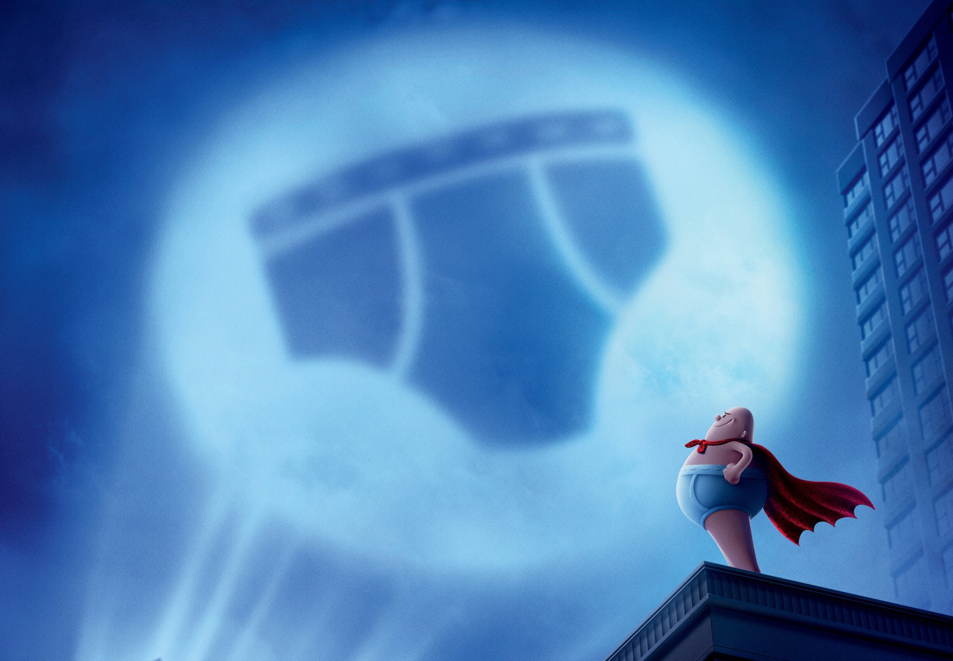 HD PC desktop wallpaper: Captain Underpants (from Captain Underpants: The First Epic Movie) stands on a rooftop in cape as an underwear-shaped moon lights a city skyline.