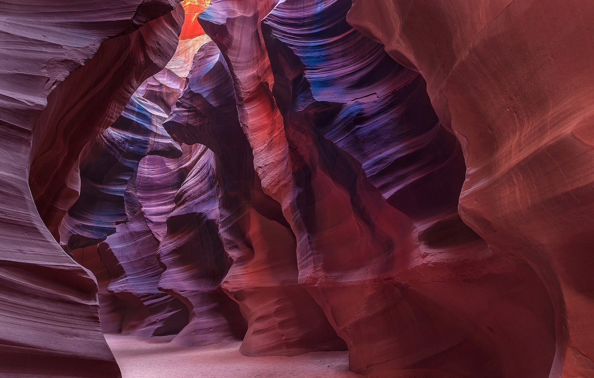 HD desktop wallpaper showcasing the vibrant, swirling rock formations and light beams of Antelope Canyon, a stunning natural canyon landscape.