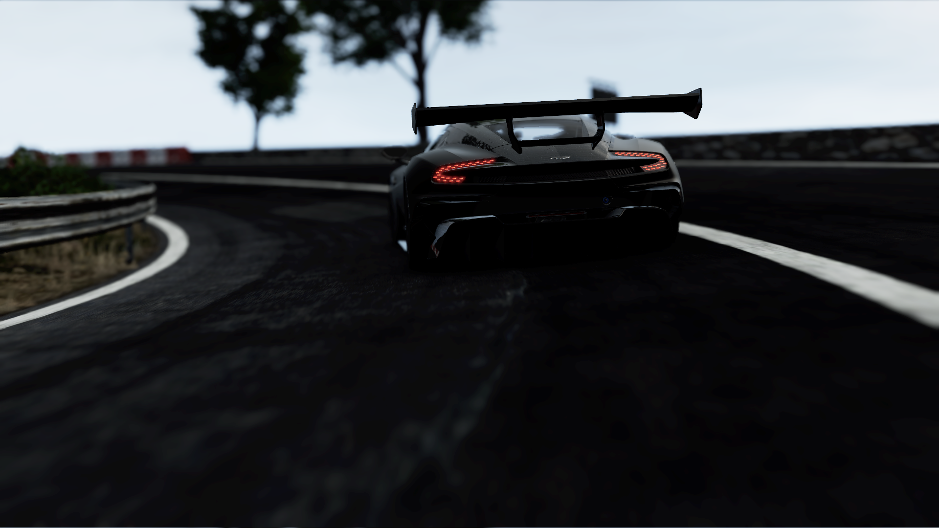 HD PC desktop wallpaper featuring the Aston Martin Vulcan racing on a track, captured from the Project Cars and Project Cars 2 video games.