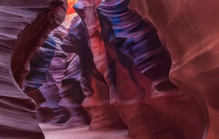 HD desktop wallpaper showcasing the vibrant, swirling rock formations and light beams of Antelope Canyon, a stunning natural canyon landscape.