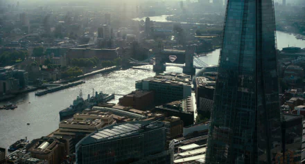 HD desktop wallpaper featuring the Superman logo prominently displayed on a building in a cityscape from the Justice League (2017) movie.
