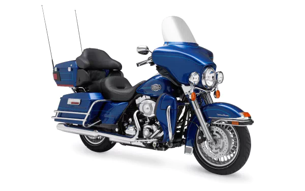 Blue Harley‑Davidson Electra Glide Ultra Classic touring motorcycle on white background — HD PC desktop wallpaper featuring the Harley‑Davidson vehicle.