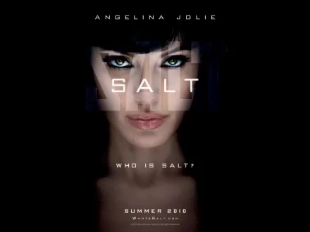 HD desktop wallpaper featuring Angelina Jolie with piercing eyes and the title Salt, promoting the action movie Salt with a dark, intense background.