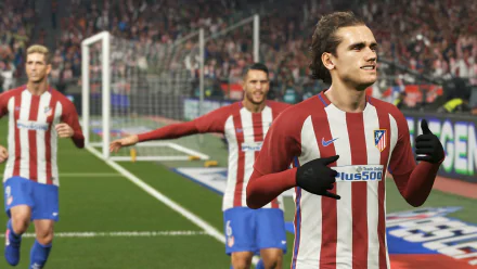 HD PC desktop wallpaper featuring Antoine Griezmann in Pro Evolution Soccer 2018, celebrating a goal while wearing Atlético Madrid's red and white kit.