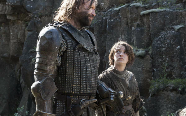 Game of Thrones characters Arya Stark and Sandor Clegane in armor on a rocky cliff, cinematic 4K Ultra HD PC desktop wallpaper/background.