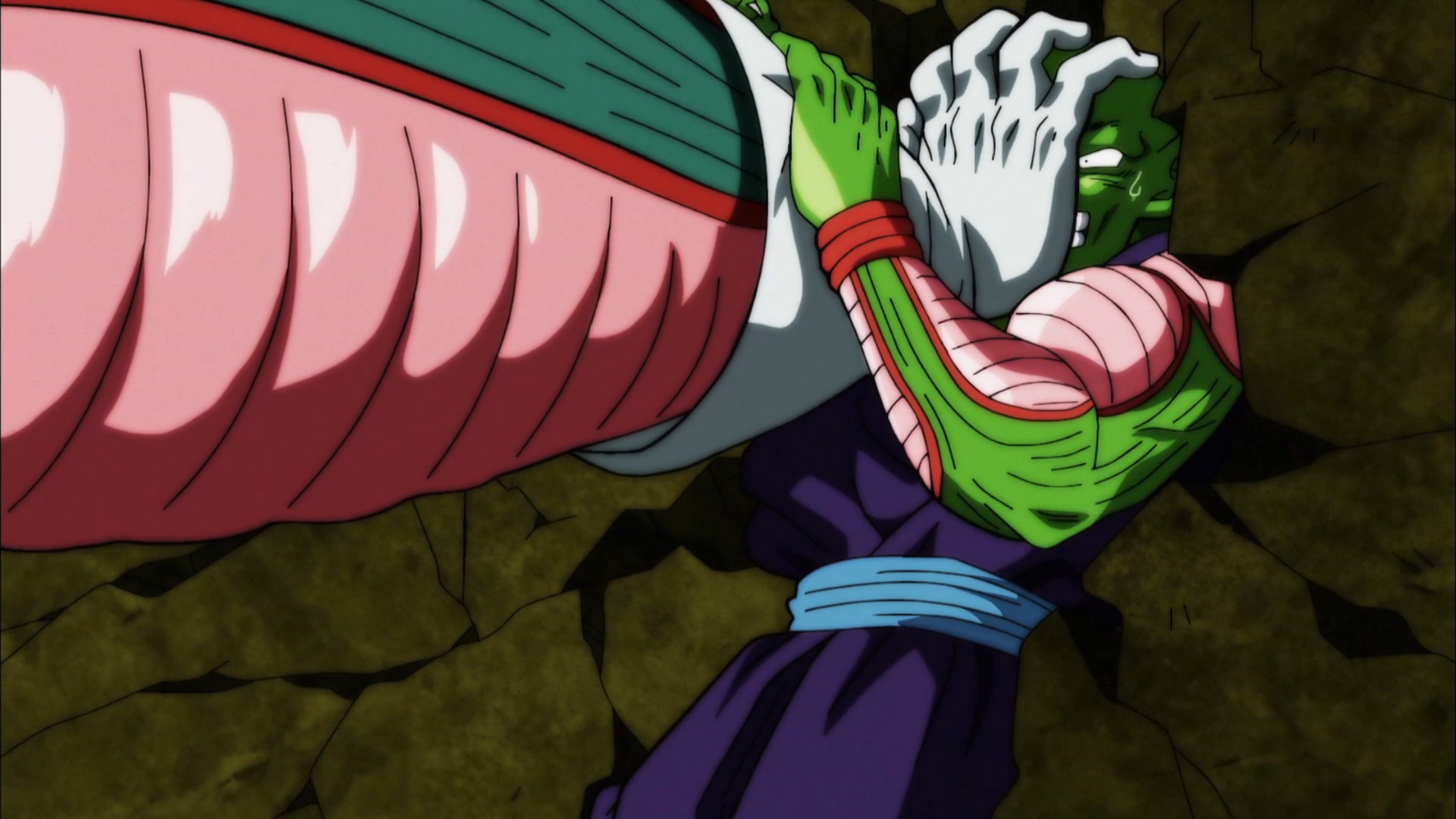 HD PC desktop wallpaper of Piccolo (Dragon Ball) from Dragon Ball Super anime, clutching his face while collapsed on cracked rock, vivid colors and dramatic shading.