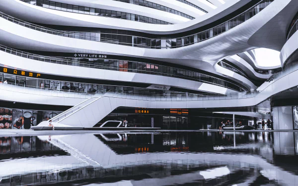 Modern architectural design of a man-made building in Beijing, featuring smooth curves and reflective surfaces, captured in HD for a PC desktop wallpaper and background.