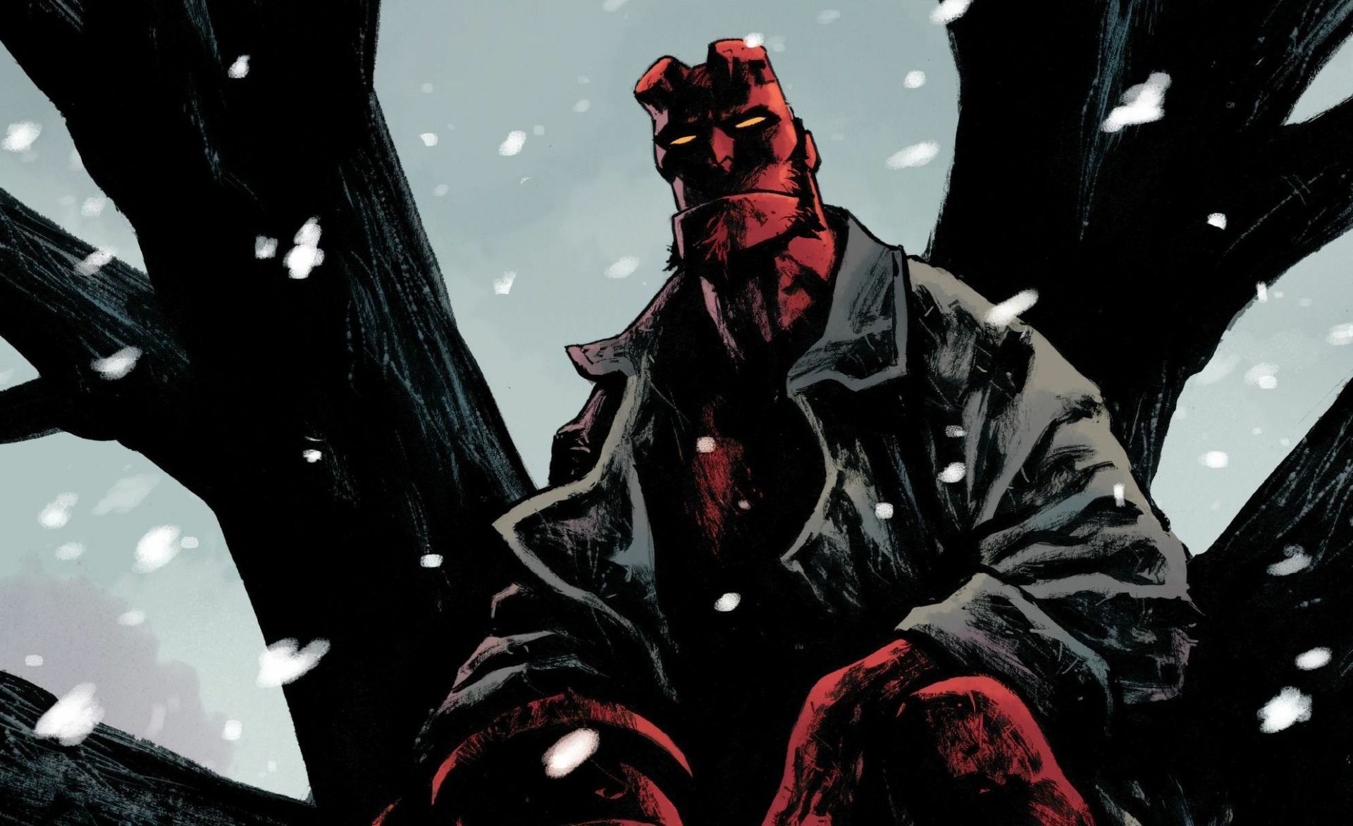 HD PC desktop wallpaper: Hellboy from the comic sits in a coat on a bare tree, red skin and stone hand visible as snow falls in a stark winter scene.