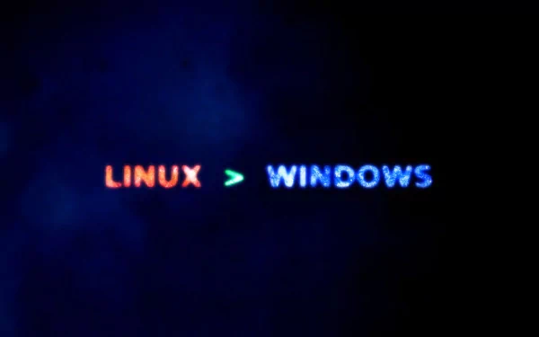 A sleek HD desktop wallpaper featuring the text LINUX > WINDOWS in vibrant colors against a dark, tech-inspired background, highlighting a preference for Linux.