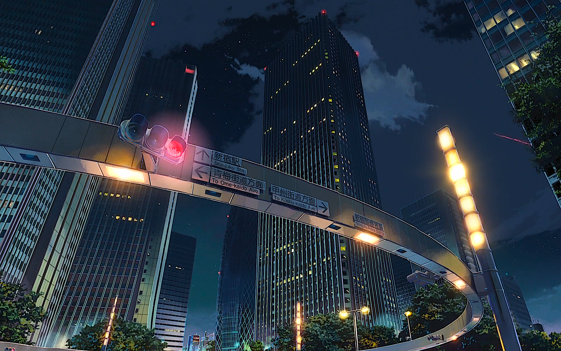 HD wallpaper featuring an anime-style night cityscape of Tokyo, with towering buildings, a traffic light, and a circular pedestrian bridge, from the series Your Name.