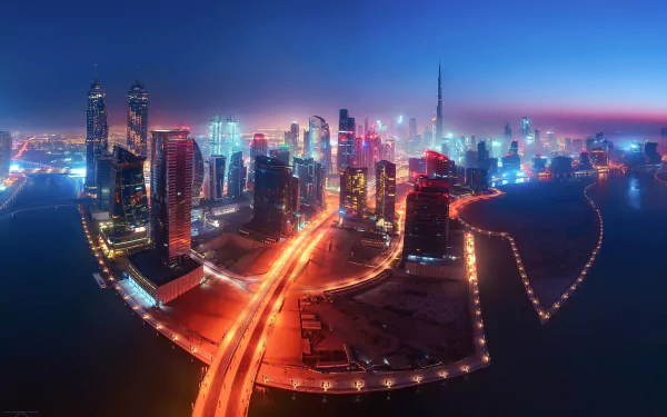A stunning nighttime view of Dubai’s illuminated skyscrapers and cityscape in the United Arab Emirates, captured in high definition with vibrant city lights.