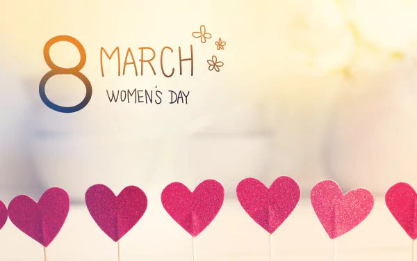 4K Ultra HD Women's Day wallpaper featuring a soft background with a row of red hearts and 8 March Women's Day text decorated with small flowers.