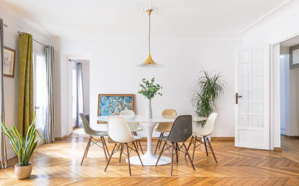 4K Ultra HD PC desktop wallpaper and background: bright modern living room with a round dining table, mixed chairs, pendant light, potted plants and herringbone wood floor.