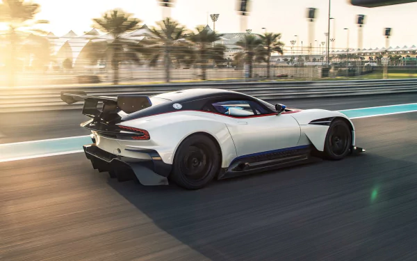 Aston Martin Vulcan speeding on a racetrack with motion blur effect, captured as a high-definition PC desktop wallpaper and background.