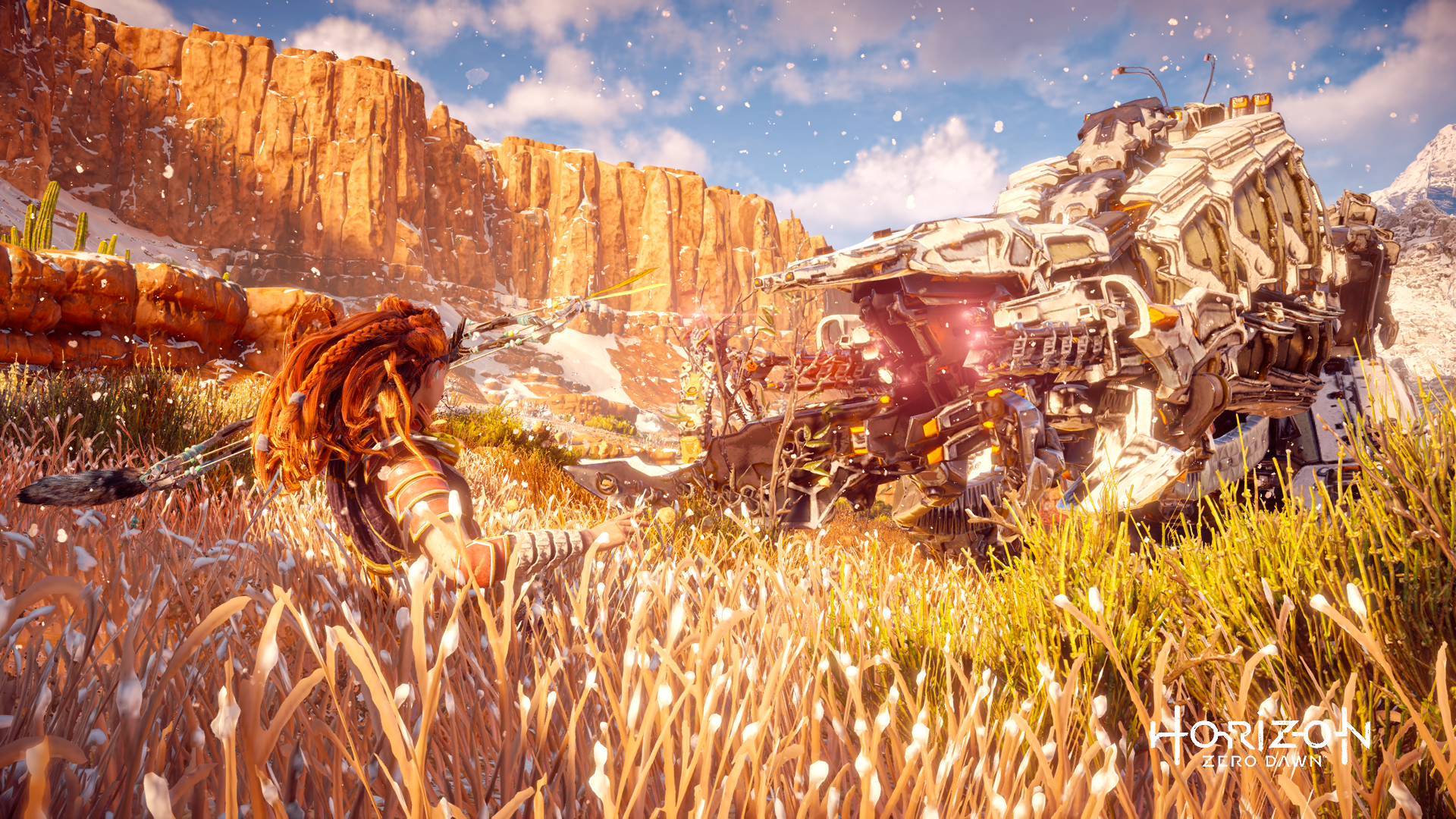 HD PC desktop wallpaper featuring Aloy from the Horizon Zero Dawn video game series in a snowy, sunlit canyon landscape facing a large robotic creature.