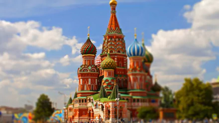 HD desktop wallpaper of Saint Basil's Cathedral in Moscow, showcasing its vibrant architecture with a tilt-shift effect against a bright sky.