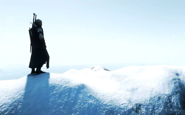 Geralt of Rivia stands on a snowy hilltop in this 4K Ultra HD PC wallpaper from the video game The Witcher 3: Wild Hunt, featuring a stark, icy landscape.