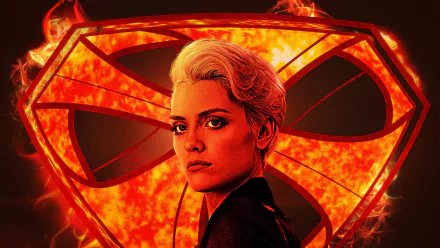 HD PC desktop wallpaper featuring Wallis Day as Nyssa-Vex from the TV show Krypton, set against a blazing fiery Superman emblem background.