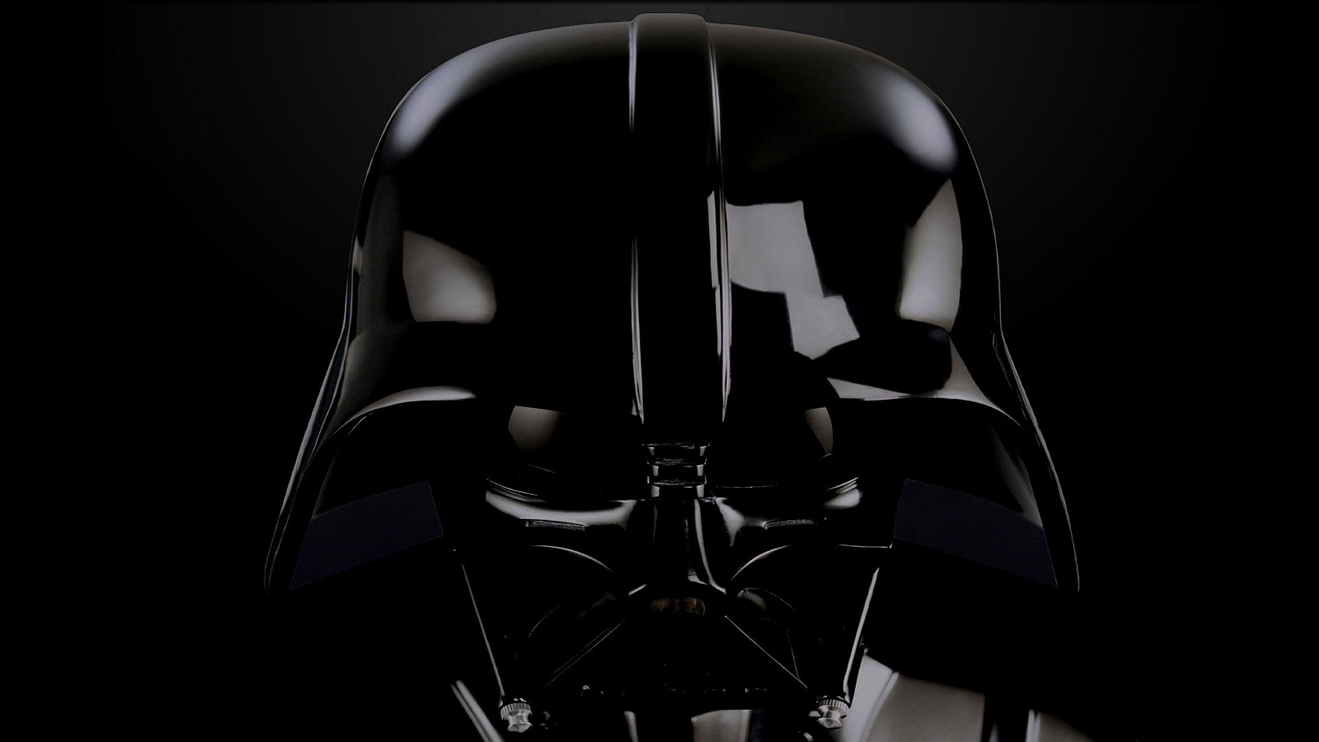 A close-up of Darth Vader's iconic black helmet against a dark background, capturing the menacing essence of the character from the Star Wars movie franchise. HD desktop wallpaper.