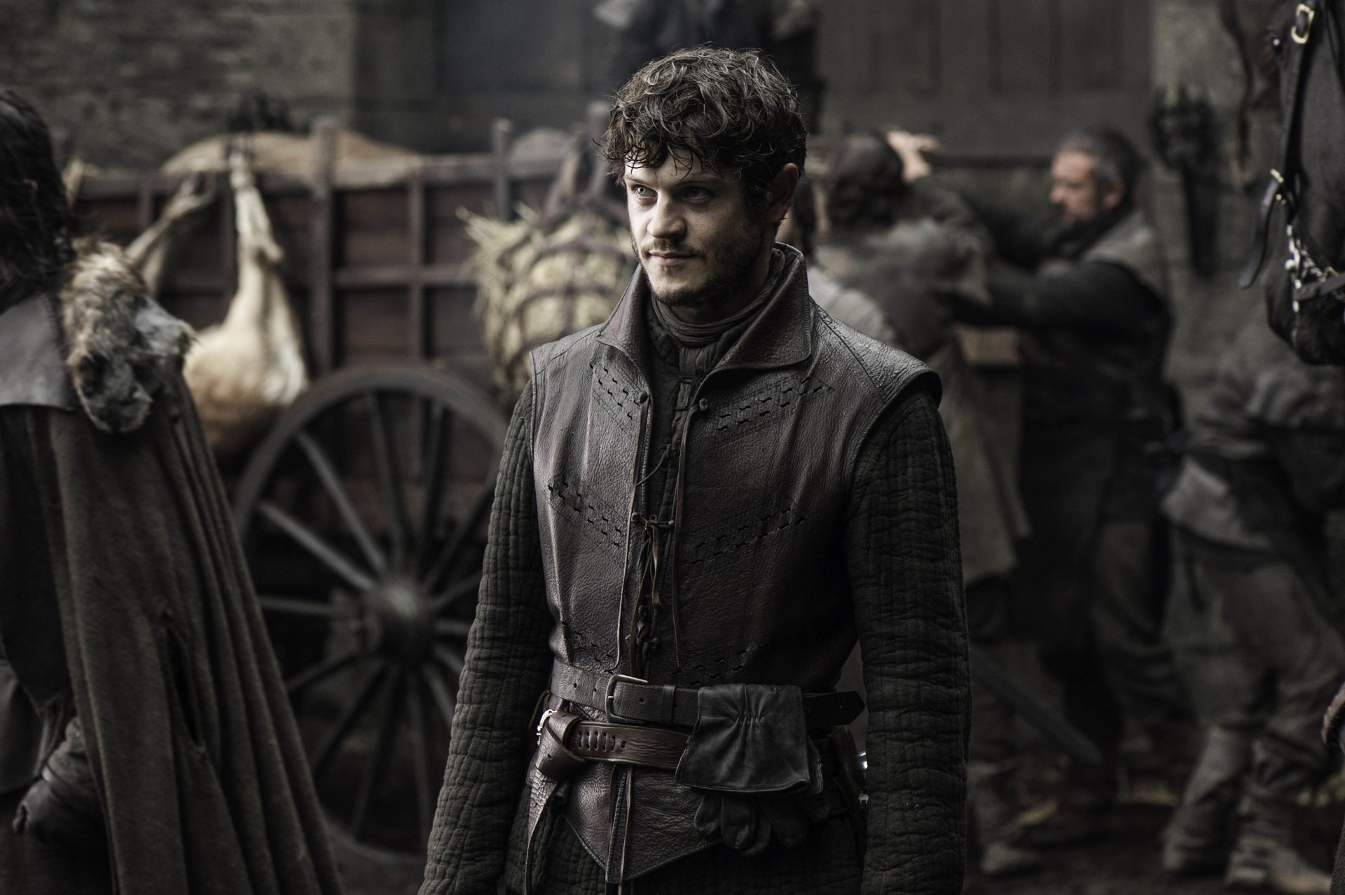 Iwan Rheon as Ramsay Bolton from the TV show Game of Thrones in a dark, medieval setting, featured in an HD PC desktop wallpaper.