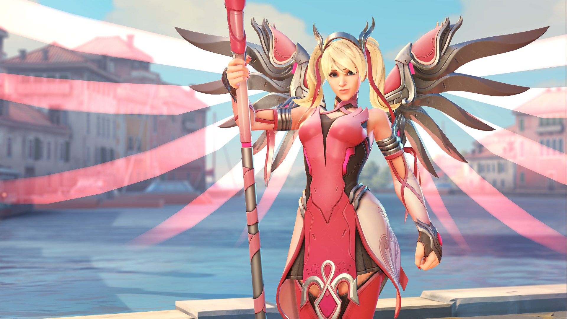 Mercy (Overwatch) in a pink Valkyrie skin, staff in hand and metallic wings spread, posed before a sunlit seaside city — 4K Ultra HD PC desktop wallpaper from Overwatch