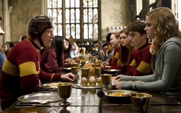 HD desktop wallpaper featuring Hermione Granger, Harry Potter, and Ron Weasley in the Hogwarts Great Hall from the movie Harry Potter and the Half-Blood Prince.