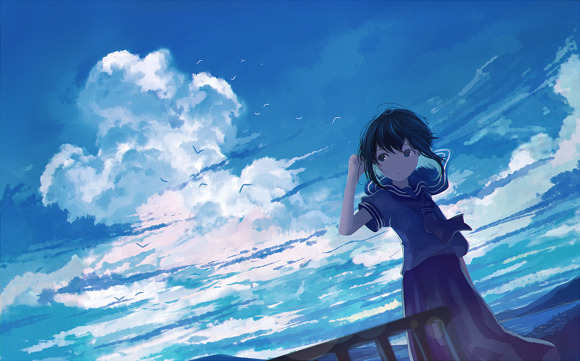Anime-style girl with short black hair and blue eyes stands on a balcony under a vibrant sky, accompanied by a small bird flying nearby in this HD desktop wallpaper.