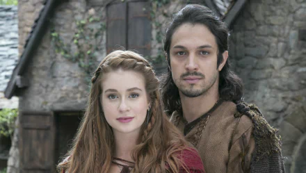 A captivating HD wallpaper featuring characters from the TV show Deus Salve o Rei, set against a rustic background, highlighting their timeless bond and regal aura.