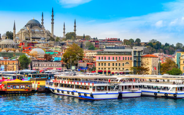 A vibrant 4K Ultra HD image of Istanbul’s skyline featuring historic mosques and bustling waterfront with boats, showcasing the city’s man-made architectural beauty.